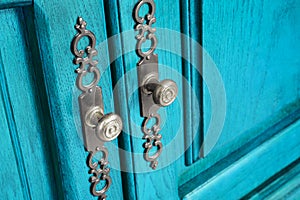 Brass door handles with ornate escutcheons photo