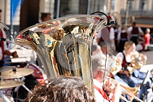 Brass instruments tuba trumpet player in street