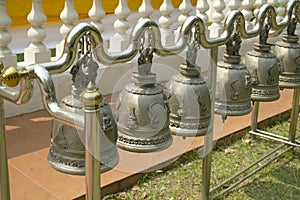 Brass metal bells hanging in northern Thai temples