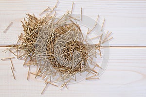 Brass nails on a wooden background