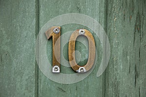 Brass number ten on door photo
