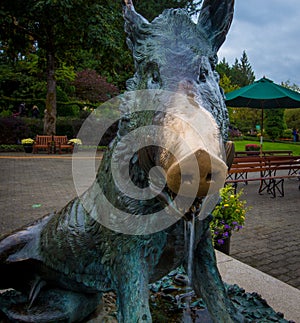 Brass pig statue in a park