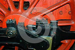 Gears and driving wheels of an old steam train locomotive photo