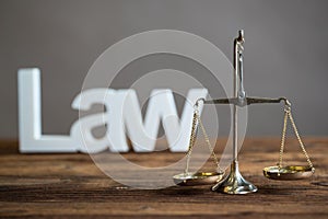 Brass Scale of justice. The criminal law.