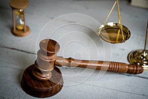 Brass scale of justice. Judge`s mallet. The criminal law.