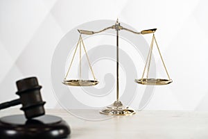 Brass scale of justice. Judge`s mallet. The criminal law.