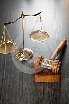 Brass scale of justice. Judge`s mallet. The criminal law.