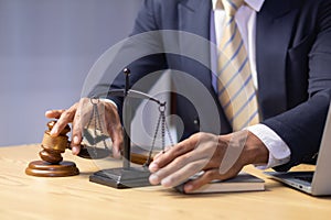 Brass scales are placed on lawyers desks in legal advice offices as a symbol of fairness and integrity in the High Court decision