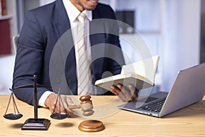 Brass scales are placed on lawyers desks in legal advice offices as a symbol of fairness and integrity in the High Court decision