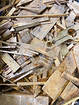 Brass scrap plate offcuts rejects from a manufacturing process.