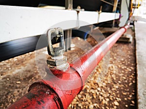 Brass springer nozzle on pipe under belt conveyor for fire fighting system