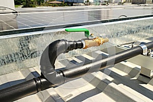 Brass Water Faucet with Thermal Welding Type HDPE Pipe on Roof for Solar Panel Cleaning photo