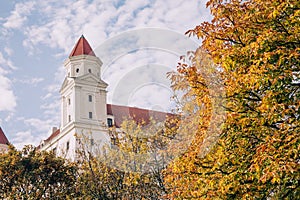 Bratislava castle framed by trees in autumn.