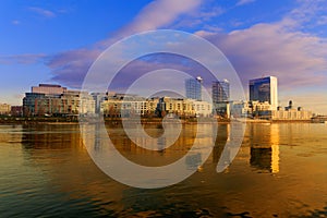 Bratislava modern skyscapers, near Danube river, gold reflection