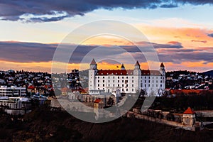 Bratislava: aerial view of Bratislava castle standing above the old town at sunset