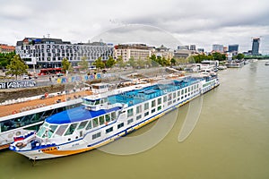 Bratislava, Slovakia - August 23, 2022: City skyline and ferry along Danube River