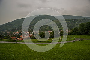 BRATISLAVA, SLOVAKIA: Beautiful landscape with hills, trees, meadows and village houses near the fortress- Devin Castle