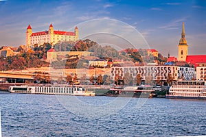 Bratislava, Slovakia. Bratislava Castle and old town over Danube River, sunrise light