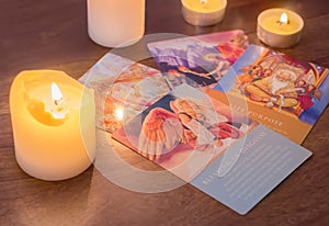 Bratislava, Slovakia, February 2, 2017: illustrative and editorial tarot cards and burning candle on wooden table