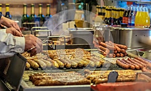 Bratwurst on the grill grid at a booth at the Christmas market i