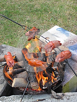 Bratwurst preparing on the fire