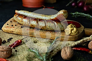 Bratwurst sausages served with mustard and herbs