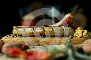 Bratwurst sausages served with mustard and herbs