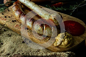 Bratwurst sausages served with mustard and herbs