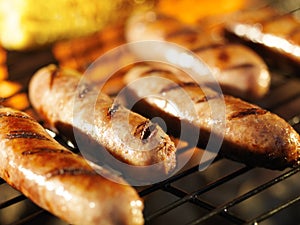 Bratwursts on grill with corn