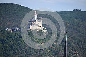 Braubach, Germany - 06 05 2023: Marksburg with the Church Tower of Rhens