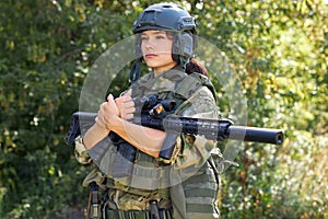 Brave caucasian woman is engaged in hunting weapon gun or rifle