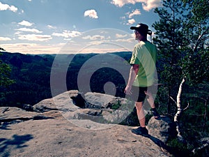 Brave cowboy camping and hiking. Man in cowboy hat walk