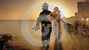 Brave Firefighter Carries Injured Young Girl to Safety where She Reunited with Her Loving Mother.