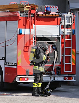 brave firefighters with fire engine truck during an exercise