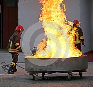 Brave firefighters during the test of a fire extinguishing