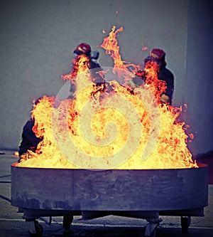Brave firefighters during the test of a fire extinguishing