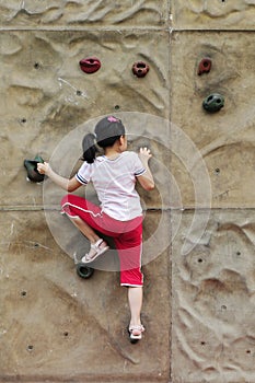 Brave Girl climbing on the wall