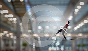 Brave ropewalker on cable. Mixed media