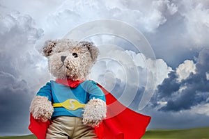 Brave super hero bear toy and stormy sky