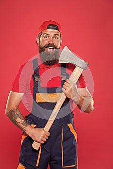 Brave worker. Cutting beard. Brutality and masculinity. Bearded lumberjack. Man builder uniform hold axe. Bearded man