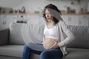 Braxton Hicks Contractions. Young Pregnant Woman Having Abdominal Pain At Home