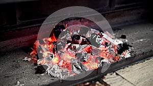 Brazier with fire and coals for cooking on fire in nature.Family vacation. Closeup shot of charcoal