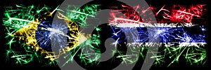 Brazil, Brazilian vs Gambia, Gambian New Year celebration sparkling fireworks flags concept background. Combination of two states