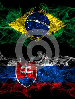 Brazil, Brazilian vs Slovakia, Slovakian smoky mystic flags placed side by side. Thick colored silky abstract smoke flags