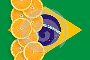 Brazil flag and citrus fruit slices vertical row photo