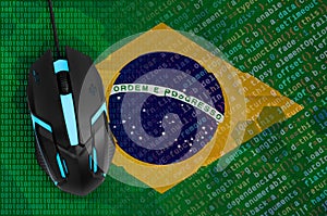 Brazil flag and computer mouse. Digital threat, illegal actions on the Internet photo