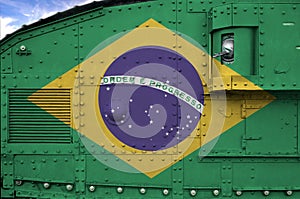 Brazil flag depicted on side part of military armored tank closeup. Army forces conceptual background photo