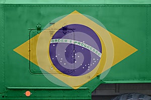 Brazil flag depicted on side part of military armored truck closeup. Army forces conceptual background photo
