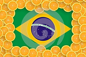 Brazil flag in fresh citrus fruit slices frame photo