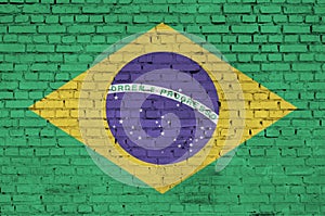Brazil flag is painted onto an old brick wall photo